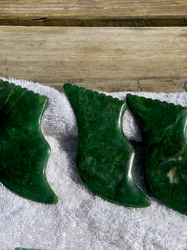Raw Nephrite stone polished to an emerald green color. Buy Nephrite stones and guasha's,