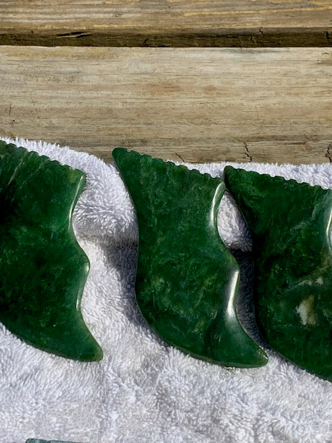 Raw Nephrite stone polished to an emerald green color. Buy Nephrite stones and guasha's,